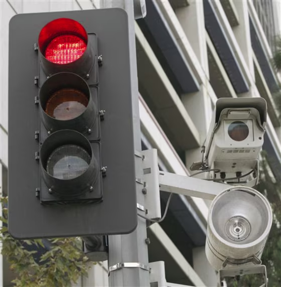 A&nbsp;red light camera set up in Los Angeles. One out of every five American lives in a community that outsources its enforcement of traffic violations caught by red light cameras to private vendors, according to a report by a consumer advocacy group. In many cases, those vendors a direct financial incentive to issue more tickets and to try to block alternative means of traffic enforcement.